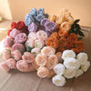 A vibrant bouquet of silk roses in shades of blue, purple, pink, and orange arranged for weddings or home decor.