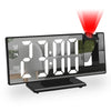 A digital projection alarm clock displaying 23:00 PM with a red light beam shining down.