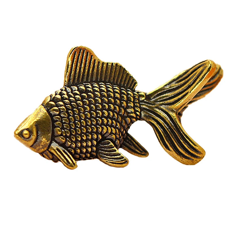 Retro brass goldfish statue with textured scales and flowing fins.