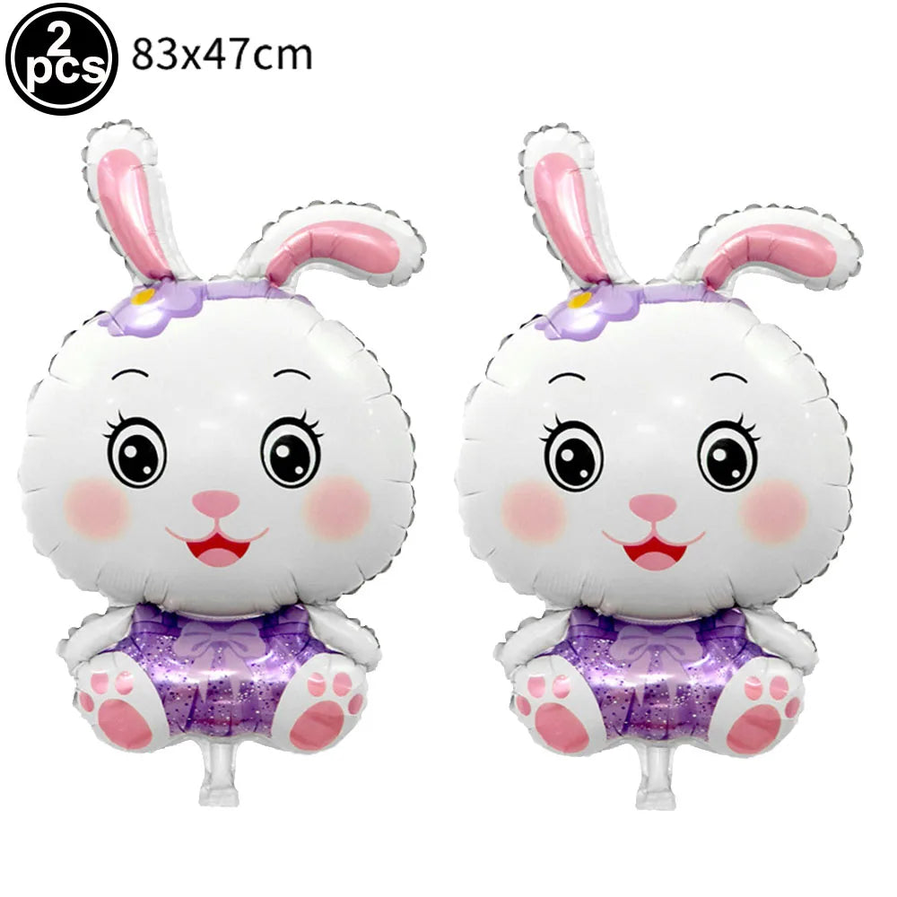 Two white bunny foil balloons with purple accents and pink ears