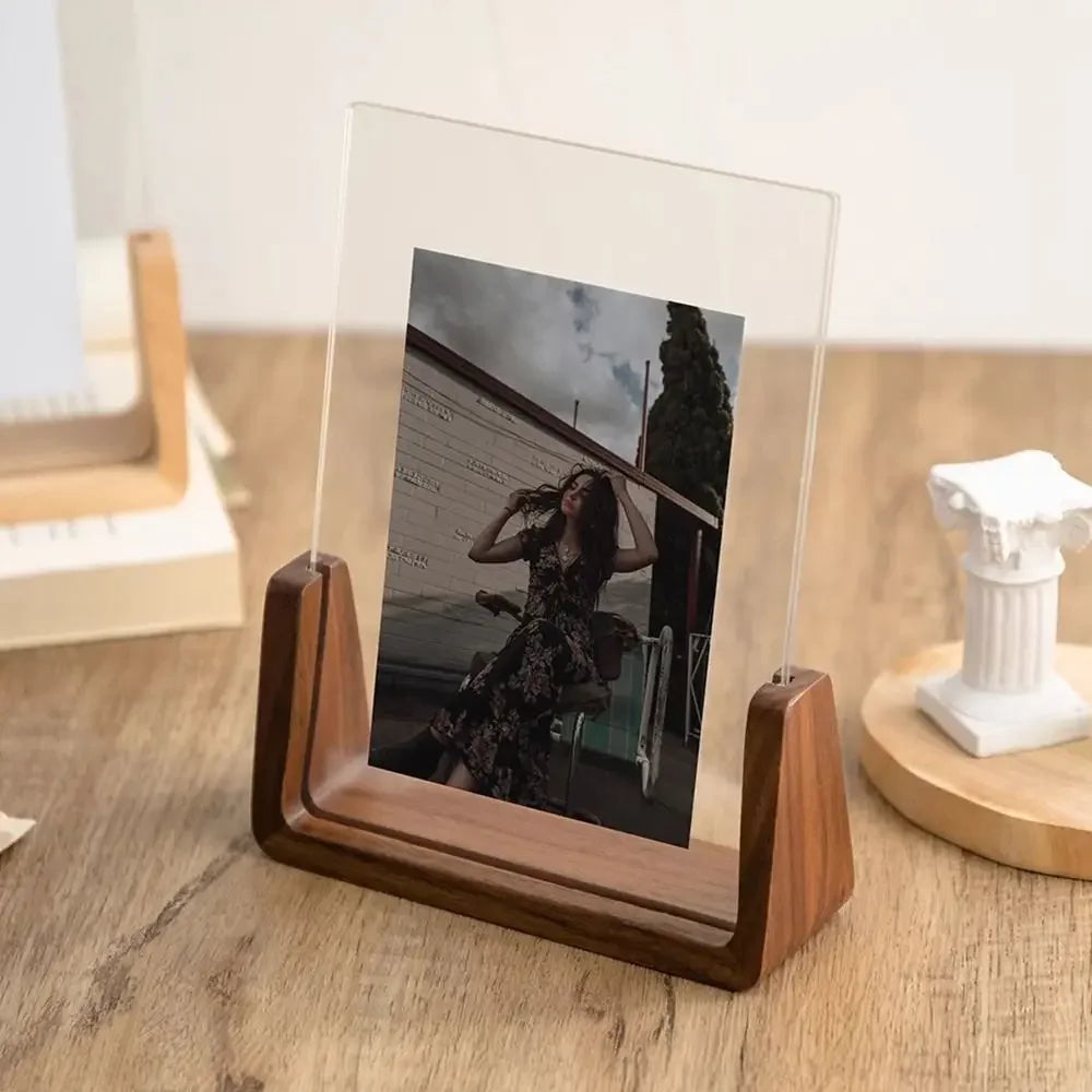 A walnut wood and acrylic photo frame displaying a black and white photograph of a woman.