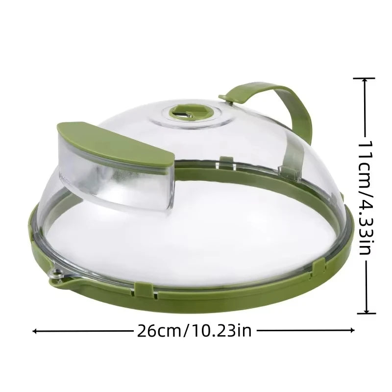Transparent microwave splatter guard with a green rim, steam vent, and handle.