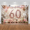 A photo booth backdrop featuring gold, pink, and white balloons and roses for a 60th birthday celebration.