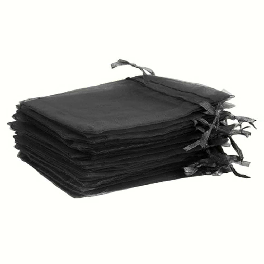 Stack of black drawstring organza bags for gifts, weddings, and parties