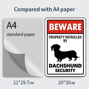 Comparison of an A4 paper size to a 20x30 cm sign featuring a Dachshund security theme.