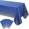 Blue and gold disposable party table linen with polka dots and folded napkins