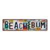 A vintage lowrider metal tin sign with the text BEACHBUM and various decorative elements.