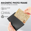 A hand holds a black magnetic photo frame with a piece of aged paper inside, demonstrating its reusable and fashionable featu