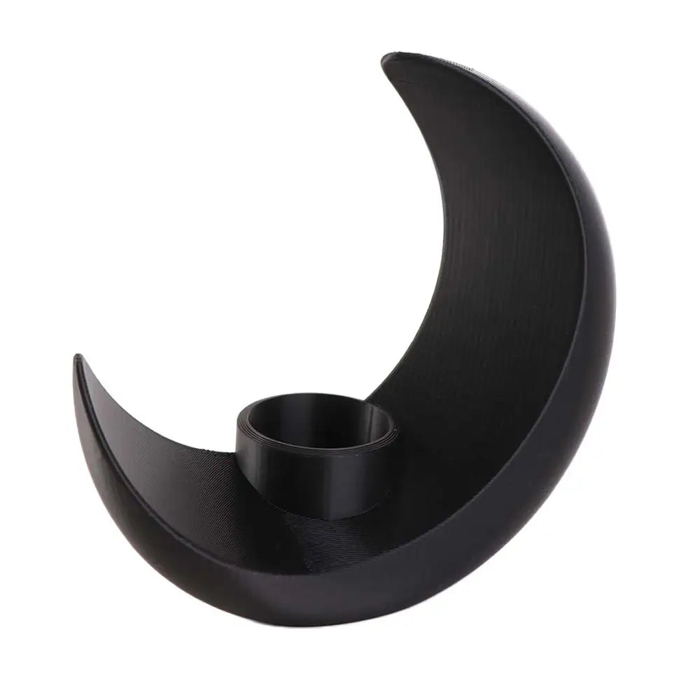 A black, modern moon-shaped decorative vase with a smooth, curved design.