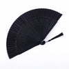 Black traditional Chinese folding fan with pleated paper blades.