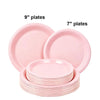 A set of pink disposable paper plates, including 7 inch and 9 inch round plates.