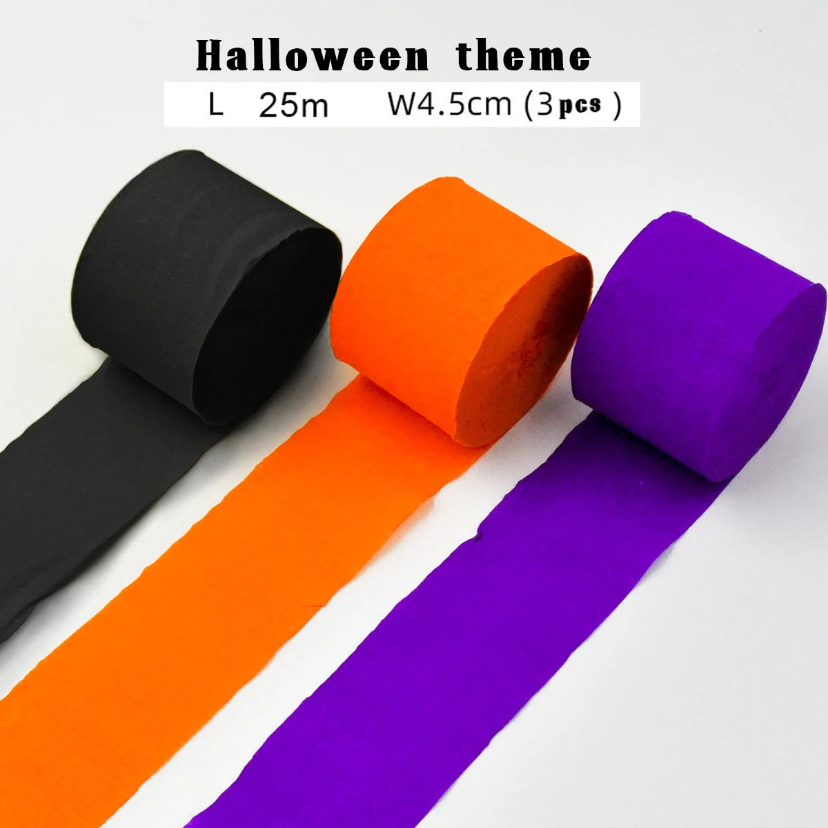 Halloween-Girlanden aus schwarzen, orangefarbenen und lila Crêpepapierrollen.
