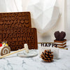 A set of heart-shaped silicone chocolate molds featuring letters and numbers arranged in a decorative pattern.