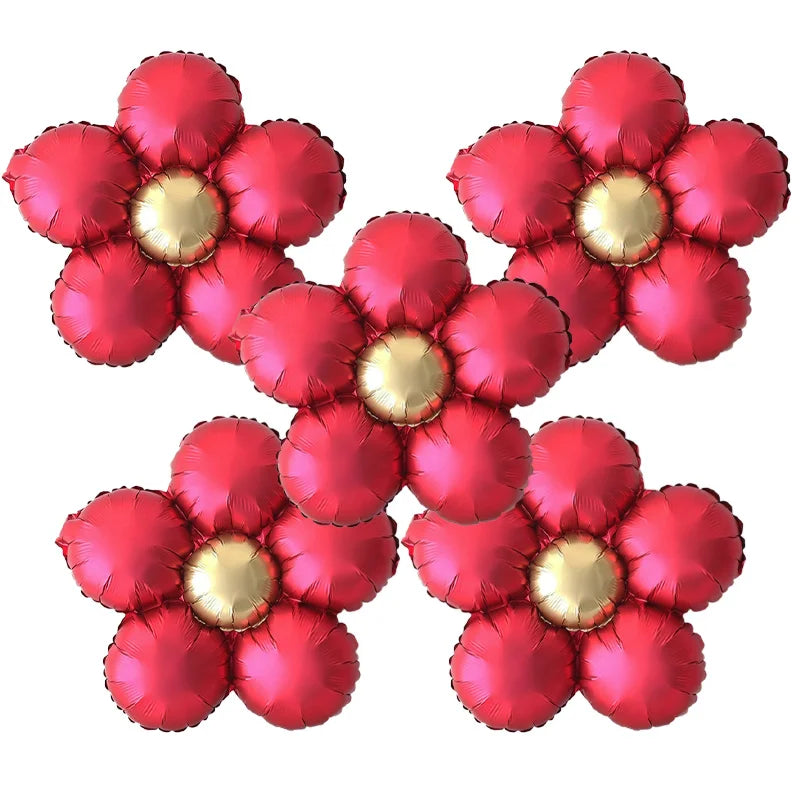 A set of five matte foil flower balloons in red and pink daisy designs.