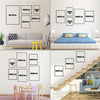 A set of vintage formula racing poster canvas prints displayed on a wall and stairs.