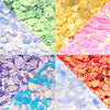 A mosaic of colorful sea shell PVC sequins in various shades including green, yellow, pink, and blue.