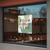 A window view of a modern interior with a large poster print displaying the text Your Logo Here.