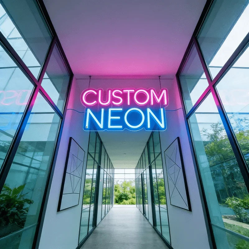 A bright neon sign spelling CUSTOM NEON is displayed in a modern glass hallway with vertical panels.