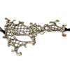 An intricate gold-colored lace masquerade mask with an ornate, antique design.
