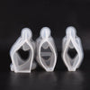 Three clear silicone molds shaped like abstract leaves or petals for resin art and crafting