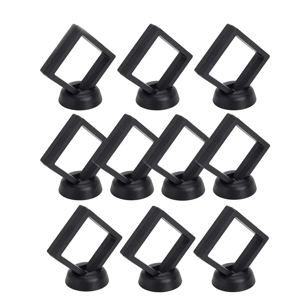 A set of ten black floating shadow box jewelry display frames for gift boxes.