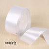 Roll of white silk satin ribbon for gift wrapping and craft projects