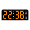 A black digital alarm clock displaying 22:38 with orange numerals and a mood light feature.