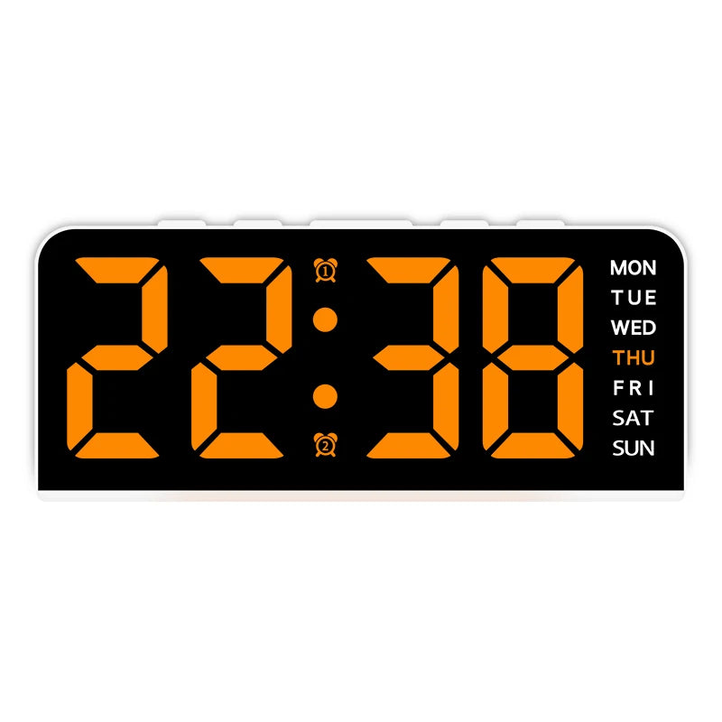 A black digital alarm clock displaying 22:38 with orange numerals and a mood light feature.