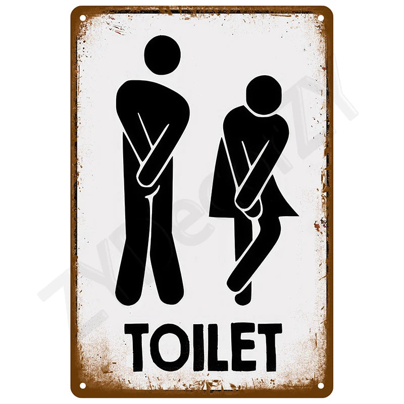 A vintage brown tin sign with a white silhouette of two figures and the word TOILET.