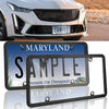 A black license plate frame with a Maryland sample plate displayed on a silver car.