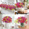 A vibrant bouquet of artificial violet flowers in pink, yellow, and red arranged in a glass vase.