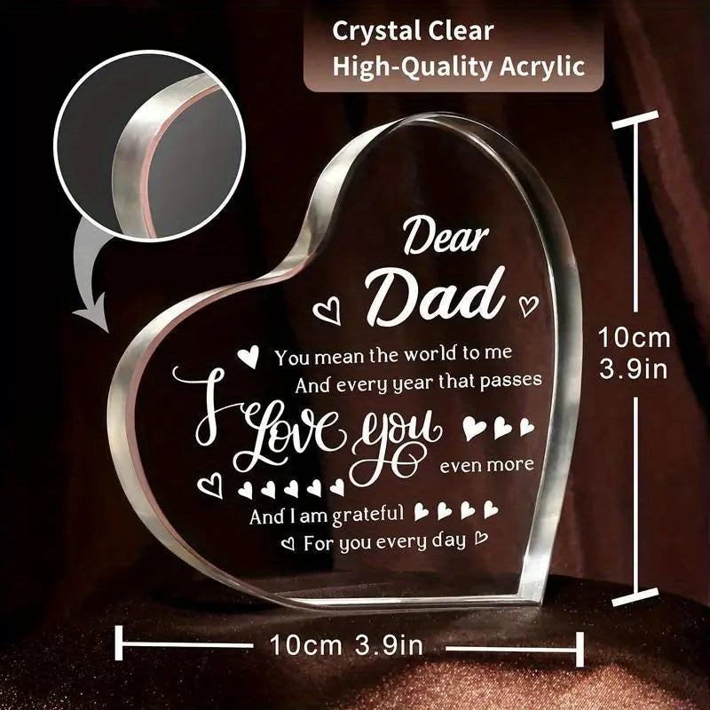 A clear acrylic heart plaque engraved with the message I love you dear dad and grateful for you every day