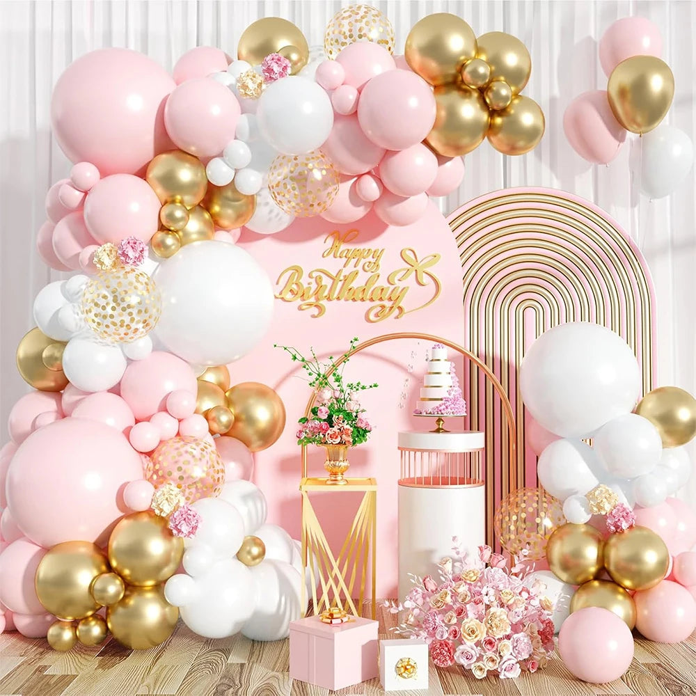 A pink and gold balloon garland arch kit featuring balloons, confetti, and floral arrangements.
