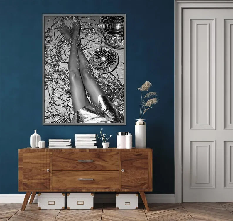 A framed black and white canvas art print featuring a leopard print silhouette against a dark background.
