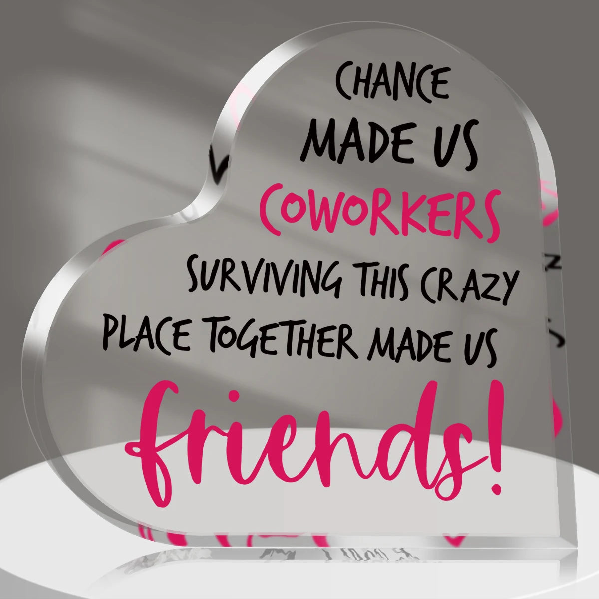 A clear heart-shaped plaque engraved with the text Chance made us coworkers surviving this crazy place together made us frien