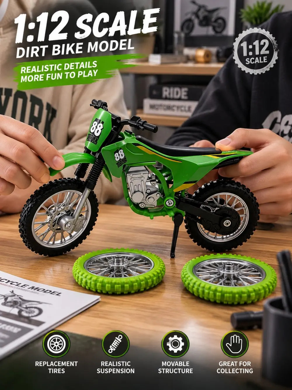 A green 1:12 scale dirt bike model is displayed on a wooden surface with spare tires and accessories.