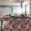 Close-up of colorful mandala peel and stick wall tiles used as a kitchen backsplash.