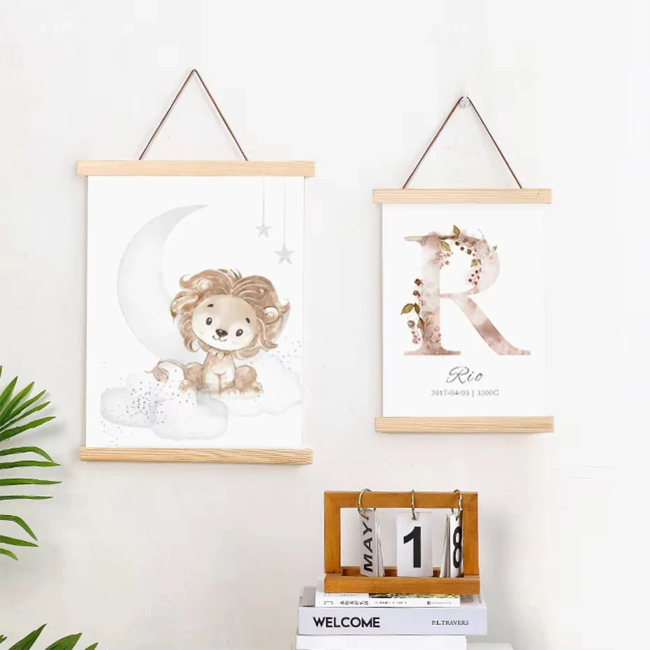 A set of two natural teak wood magnetic poster frames displaying lion and letter art on a white wall.