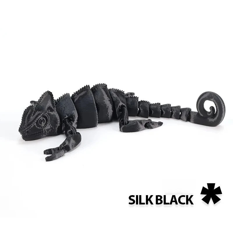 A black articulated dragon lizard figurine with textured scales.
