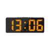 A black LED digital alarm clock displaying the time 13:06 with an orange backlight.