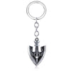 Silver arrow metal keychain featuring a stylized trident design