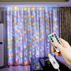 A hand holds a remote control for USB-powered LED curtain lights illuminating sheer white fabric.