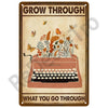 Vintage metal tin sign with the text Grow Through and What You Go Through surrounded by floral illustrations.