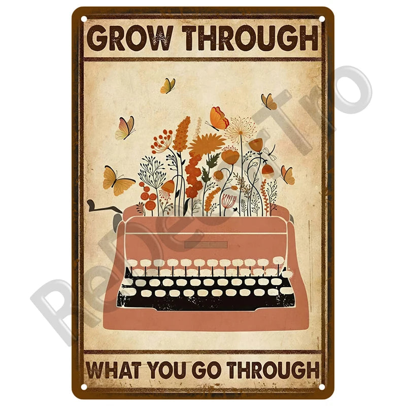 Vintage metal tin sign with the text Grow Through and What You Go Through surrounded by floral illustrations.