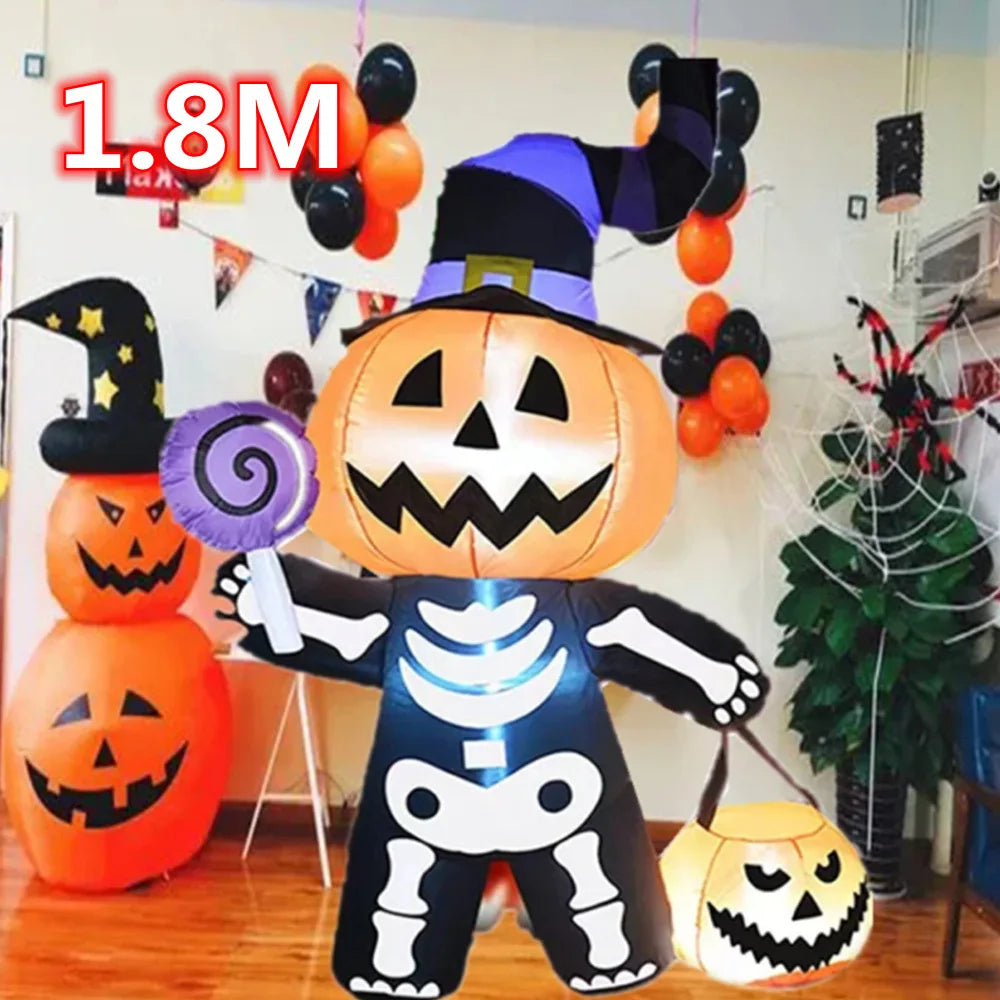 A large inflatable Halloween pumpkin decoration with a carved face and built-in LED lights stands next to other orange pumpki