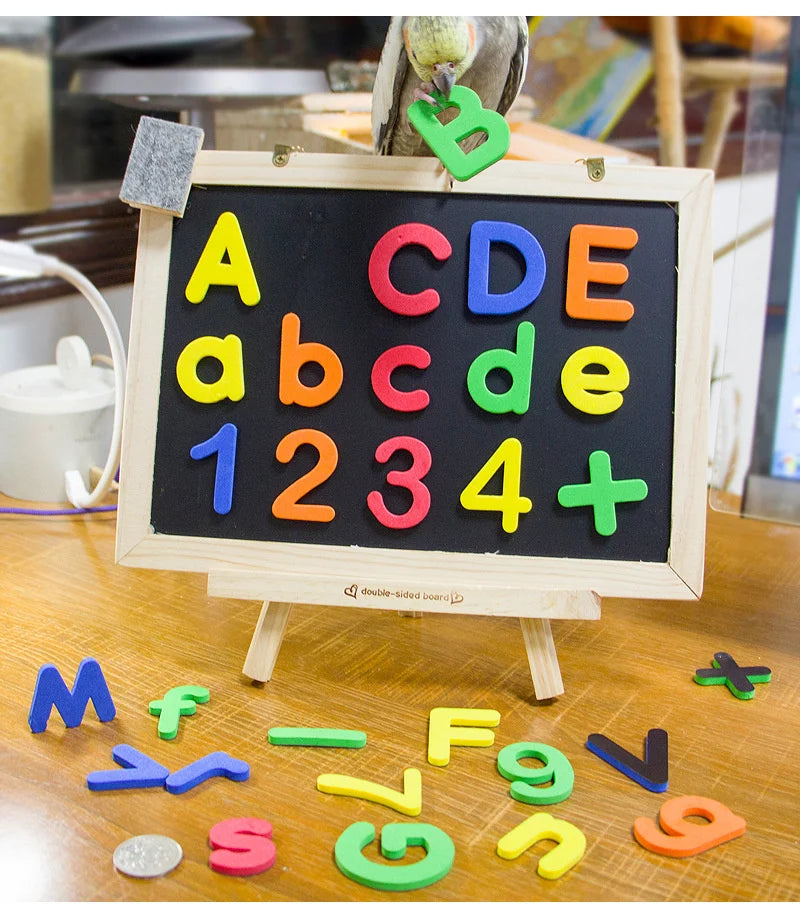 A wooden board displaying magnetic letters and numbers like A, B, C, D, E, 1, 2, 3, 4, and a plus sign.