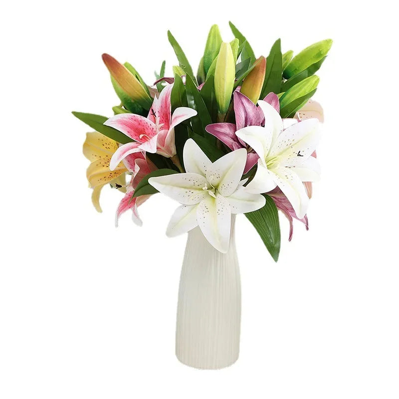 A bouquet of realistic silk lily flowers in shades of pink, white, and green stems.