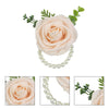 Elegant wrist corsage bracelet featuring pale peach roses and pearl beads for weddings