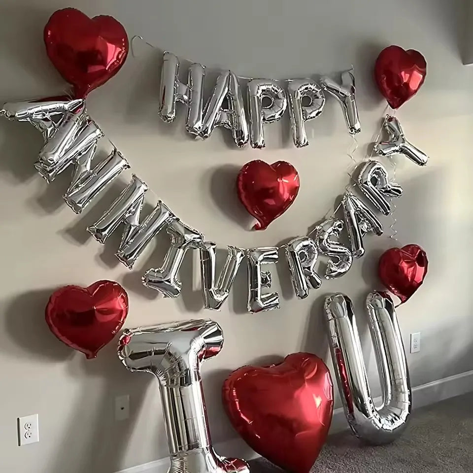 Silver and red foil balloons spelling out Happy Anniversary