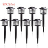 Eight black solar powered LED pathway lights with square lanterns